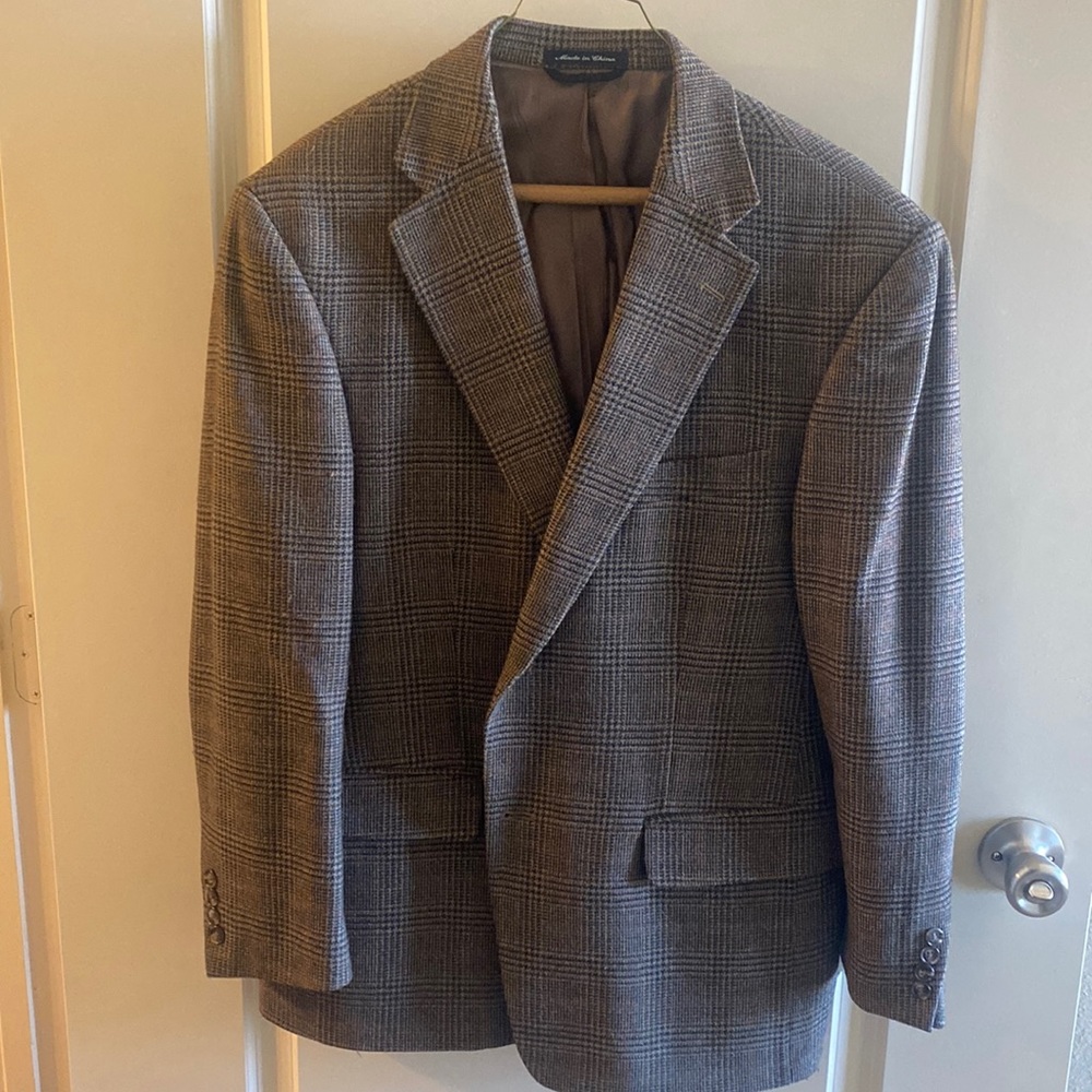 Brown plaid sports coat. Great condition. One small hole on the inside lining.